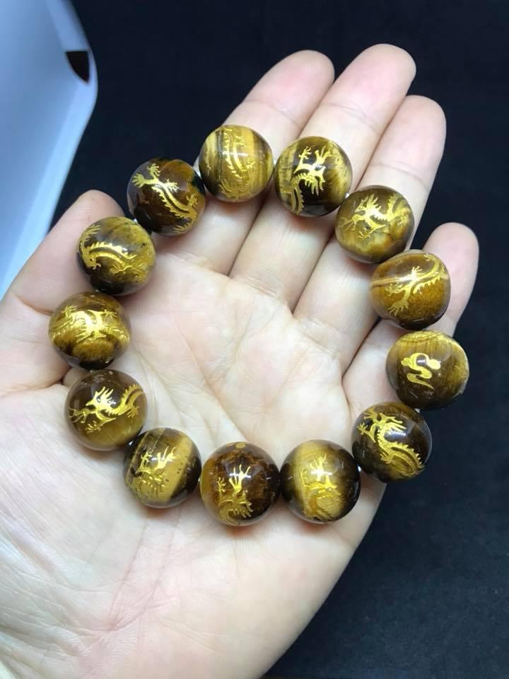 Vòng tay đá mắt hổ chạm rồng 16ly.