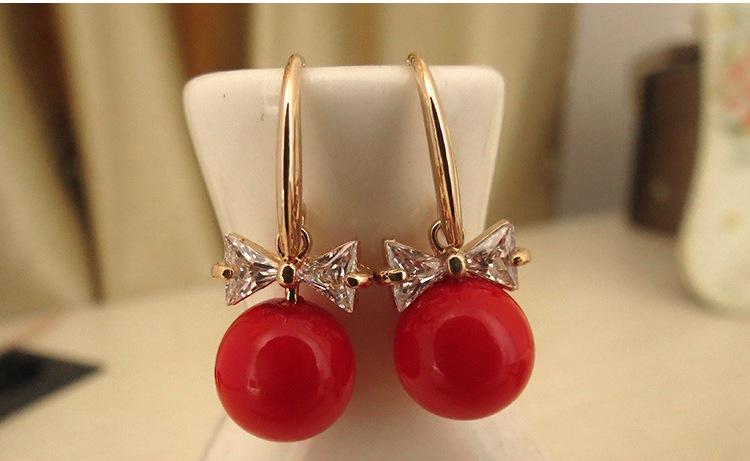Bông tai nơ đá đính hạt giả ngọc trai