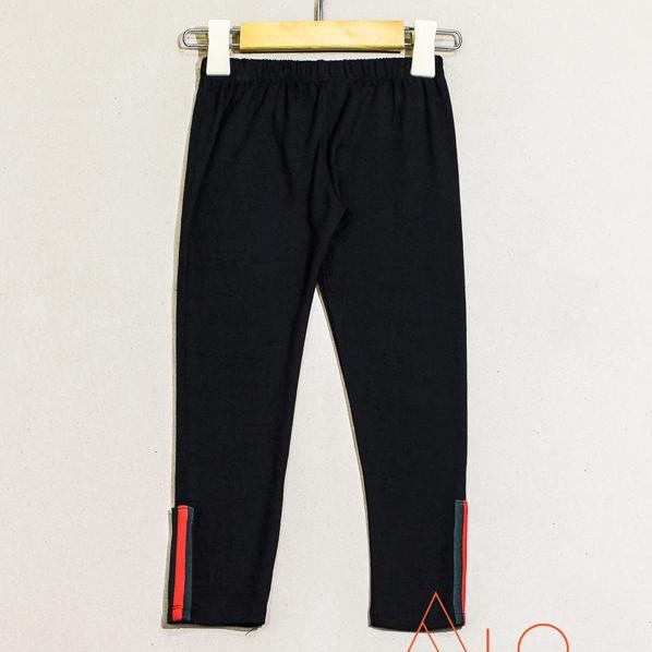 Quần legging bé gái lửng phối ống đen