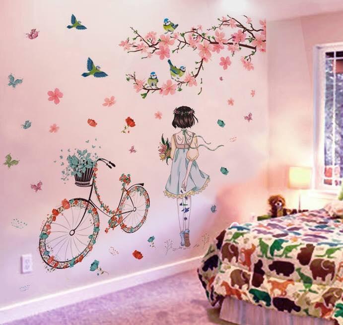Decal dán tường cành đào hồng và cô gái xe đạp