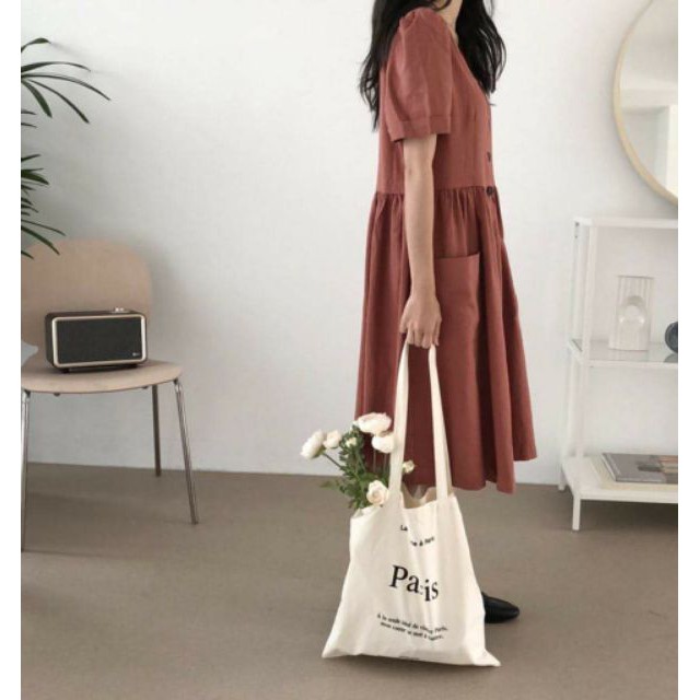 Đầm nút trước 2 túi