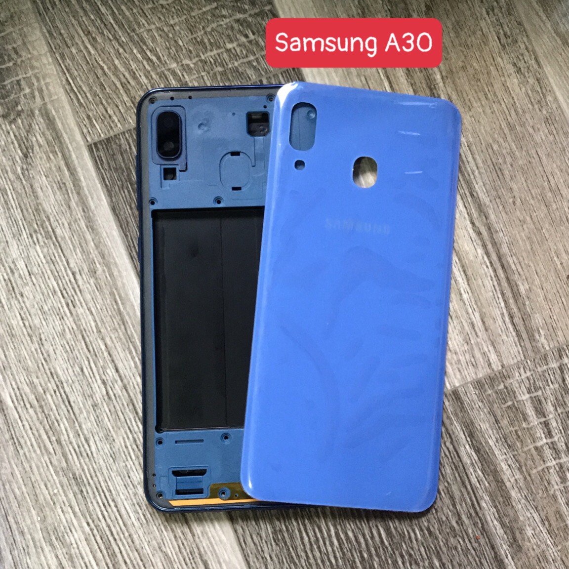Bộ vỏ samsung A30 zin (bộ gồm lưng,xương,phím bấm ,kính camera)