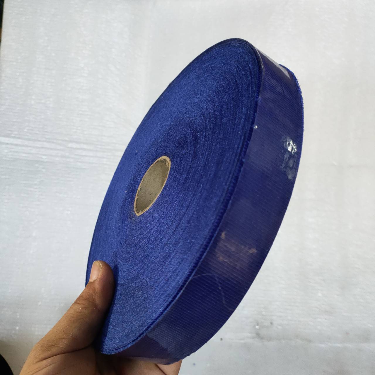 CUỘN VẢI MAY VIỀN MÀU XANH 100m.