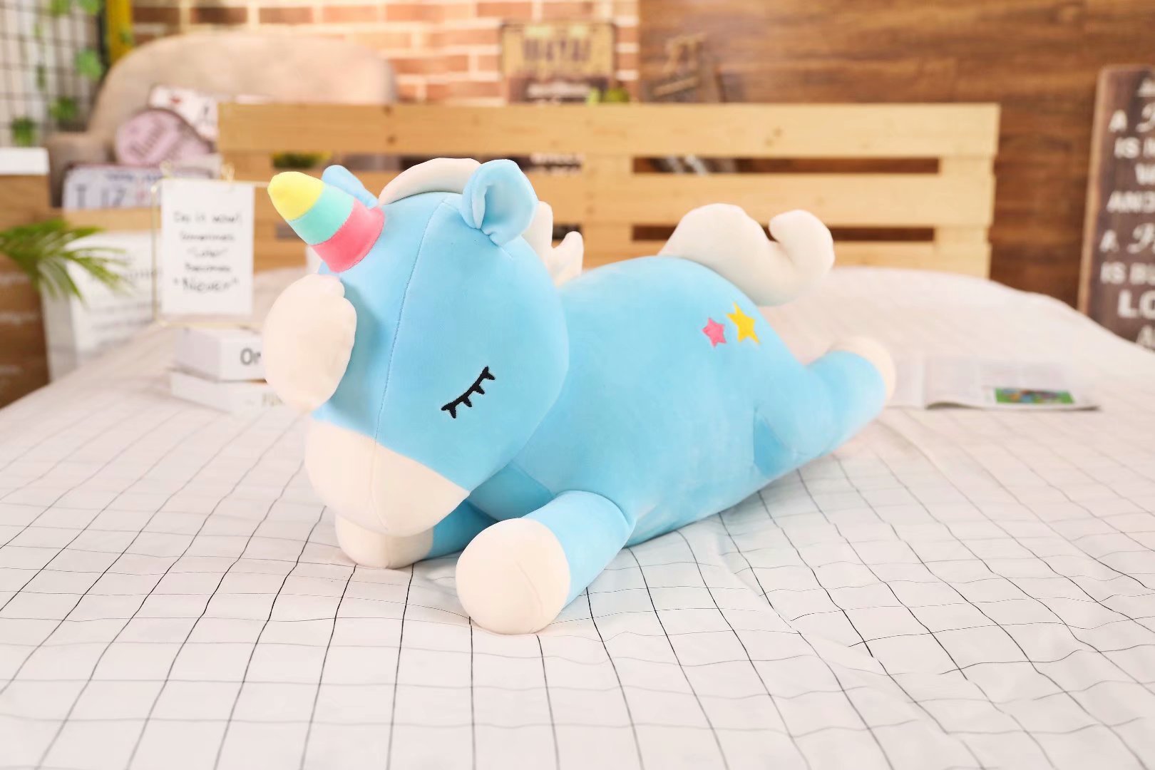 Gối mền gấu bông kỳ lân dài 60cm