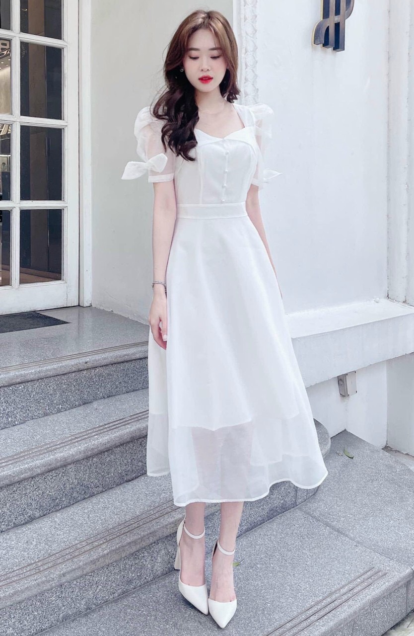 Đầm trắng công chúa đi tiệc đầm cổ vuông đính nút dáng xòe dài đầm trắng tay phồng phối lưới cột nơ tay đầm trắng 2 lớp đi tiệc nhẹ nhàng