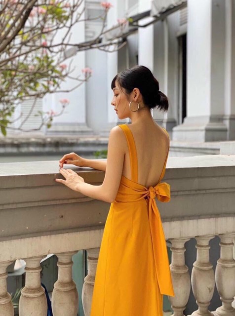 Đầm vàng nghệ nơ sau