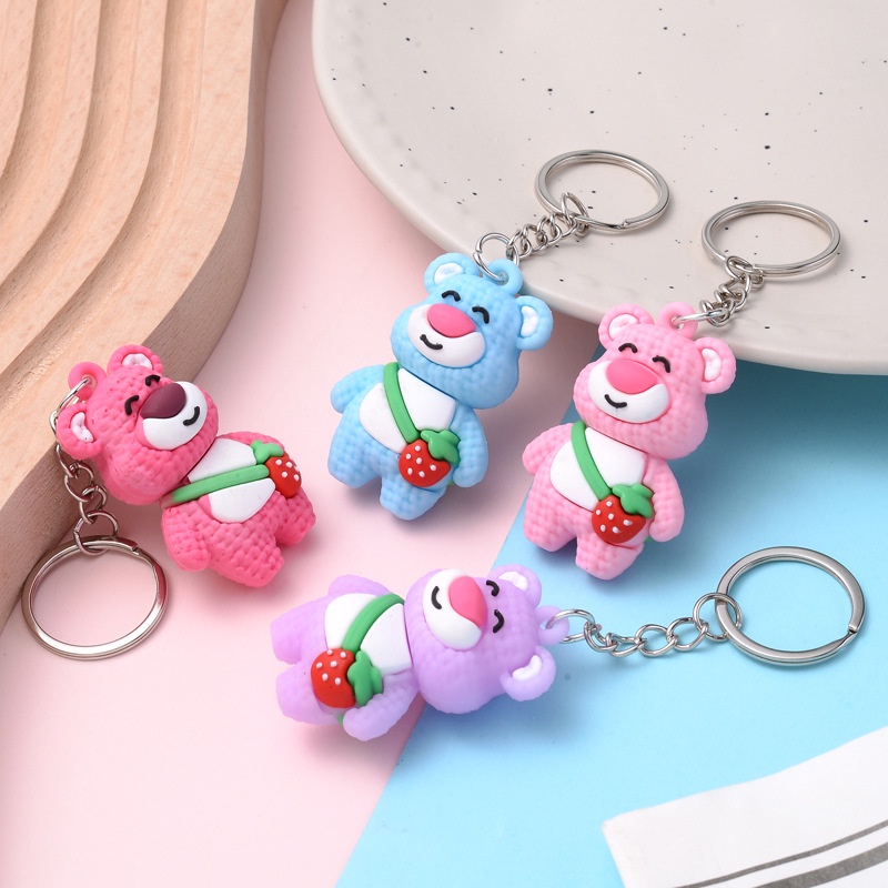 Móc khóa gấu đeo túi quả dâu cute