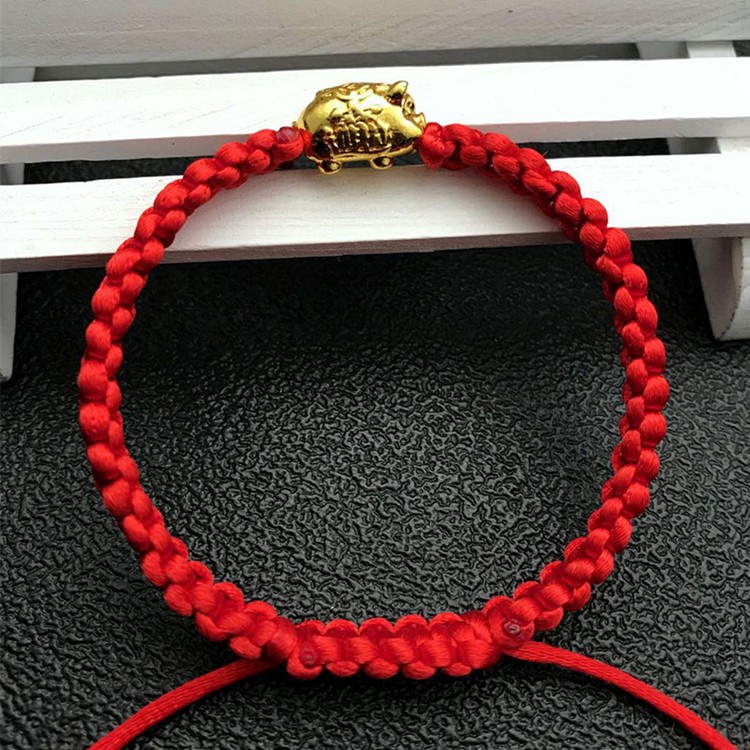 Vòng tay chỉ đỏ heo vàng thắt bím