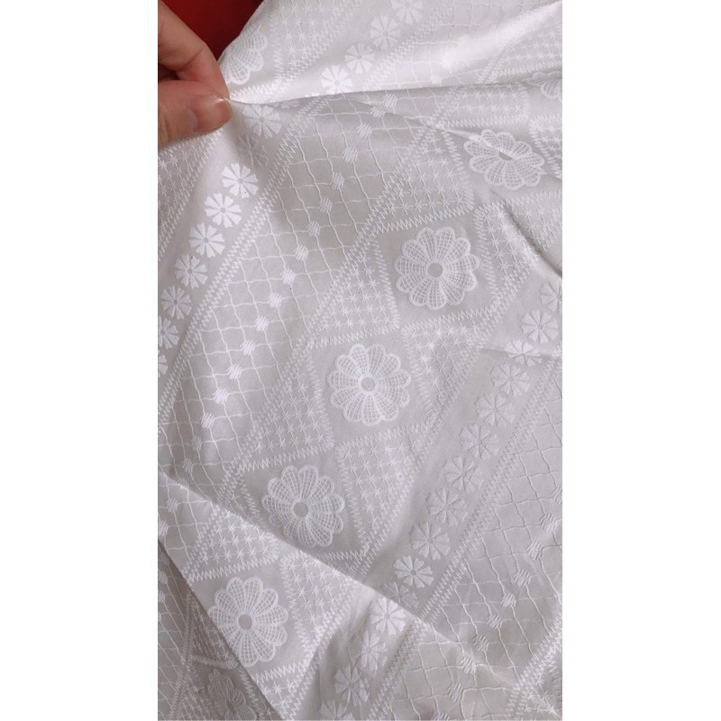 vải boi trắng trơn đục lỗ hình hoa