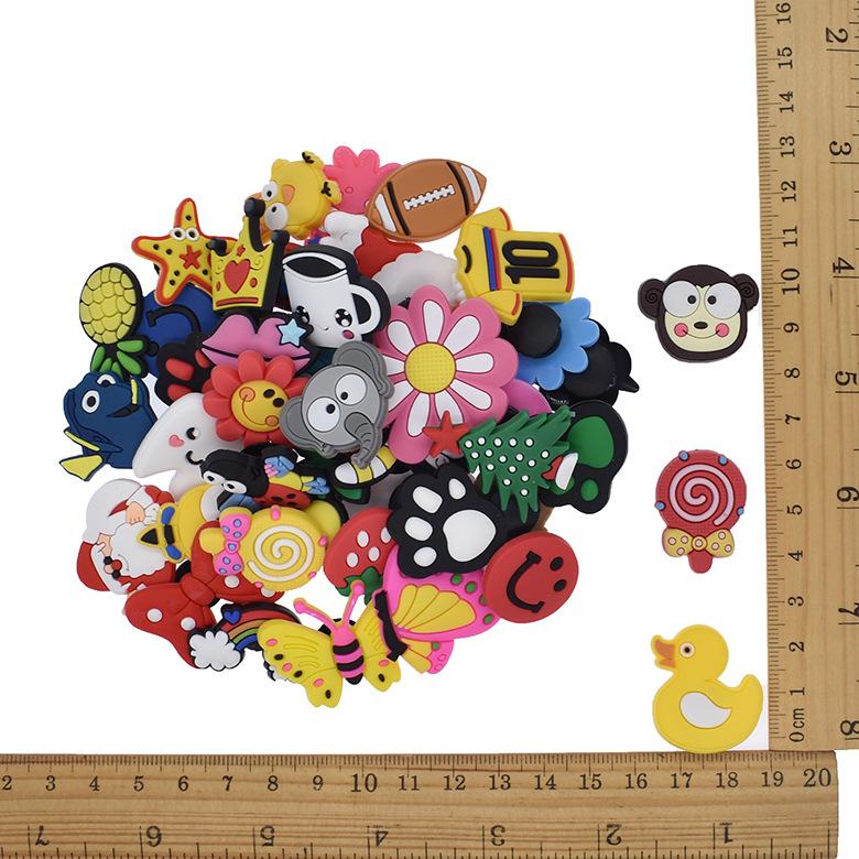 Combo 50 Jibbitz/Sticker/Nút gắn dép sục, dép cá sấu, Crocs (Mẫu ngẫu nhiên - Trộn lẫn)