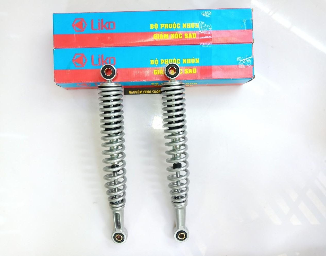 Phuộc sau xe wave alpha màu bạc liko