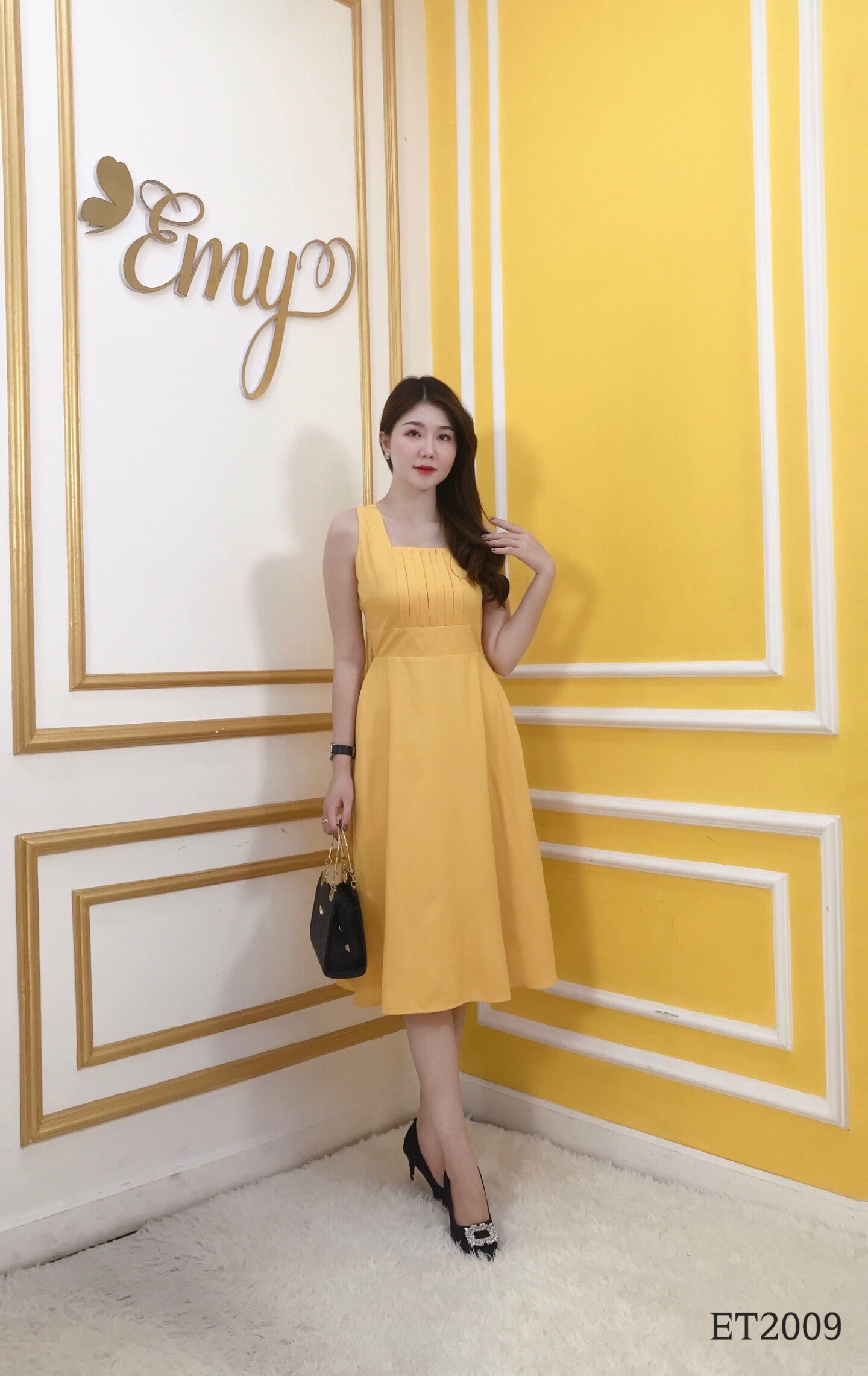 Đầm EMY ET2009 Xoè Vàng Sát Nách