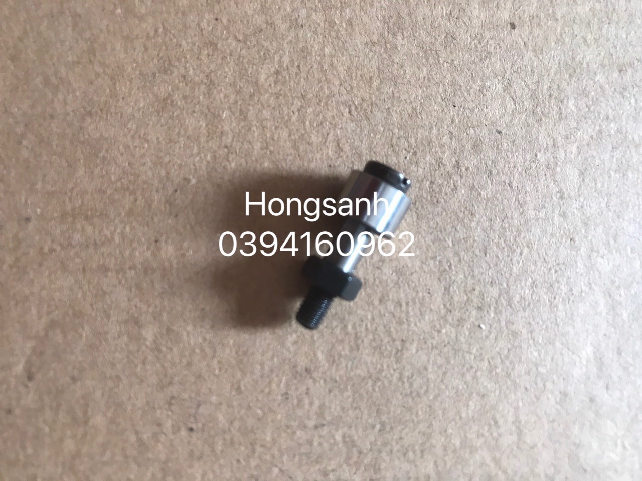 Bi cam máy may bao Newlong