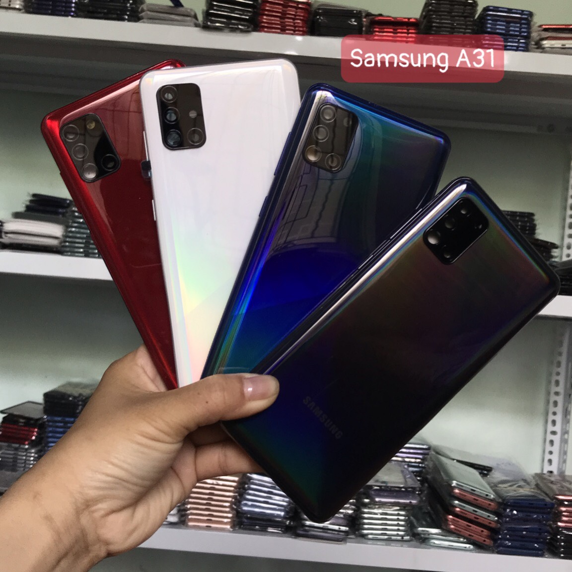 Bộ vỏ samsung A31 zin (bộ gồm lưng,sườn, nút bấm, kính camera)