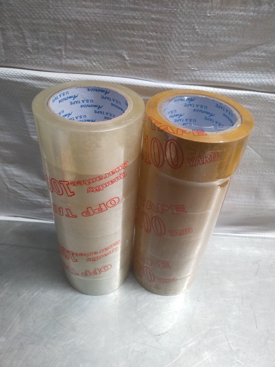 1 cây băng keo: trong - đục 100yard (6 cuộn)