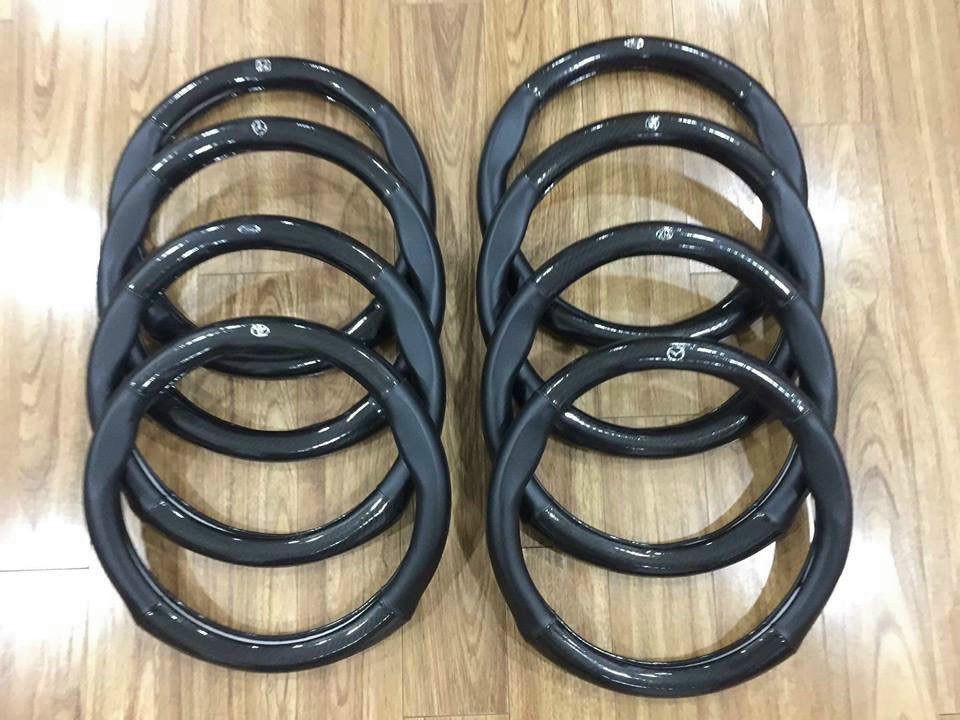 Bọc vô lăng carbon, cờ pháp, da thật thoáng khí, hàng cao cấp