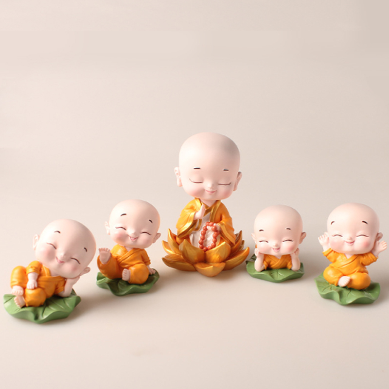 Bộ 04 chú tiểu ngồi lá sen kèm 01 chú tiểu lò xo ngồi đài sen - màu áo vàng