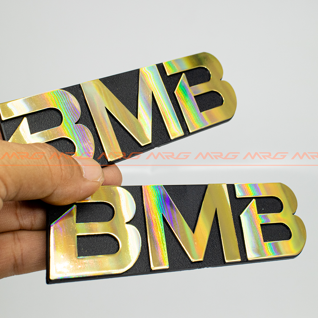 Tem BMB nhôm 13cm x 4cm , giá 1 chiếc, tem gắn loa bmb bằng nhôm có 2 chân gài phía sau tem.