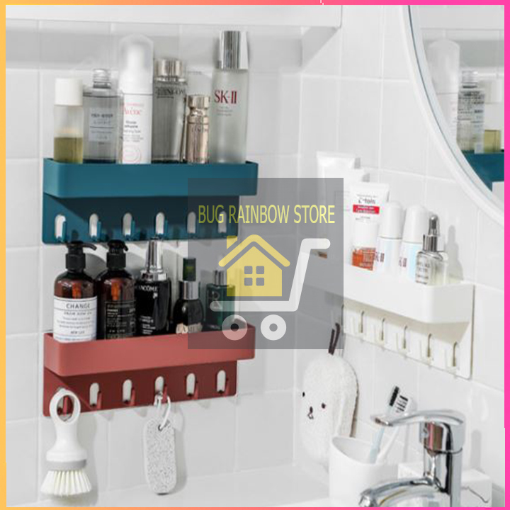 Kệ dán tường nhà tắm đa năng vừa để đồ vừa có móc treo chun buộc tóc.