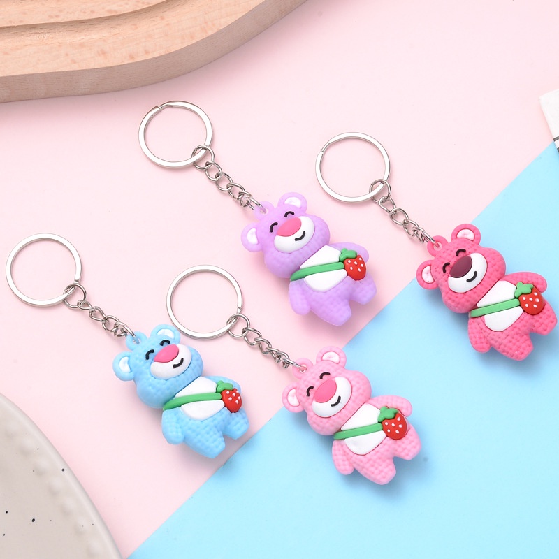 Móc khóa gấu đeo túi quả dâu cute