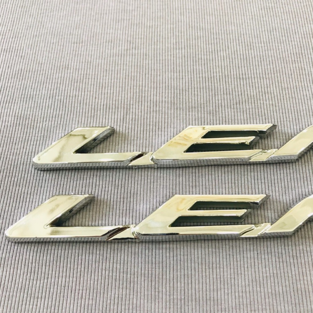 Cặp tem logo xi bóng chữ Lead màu bạc