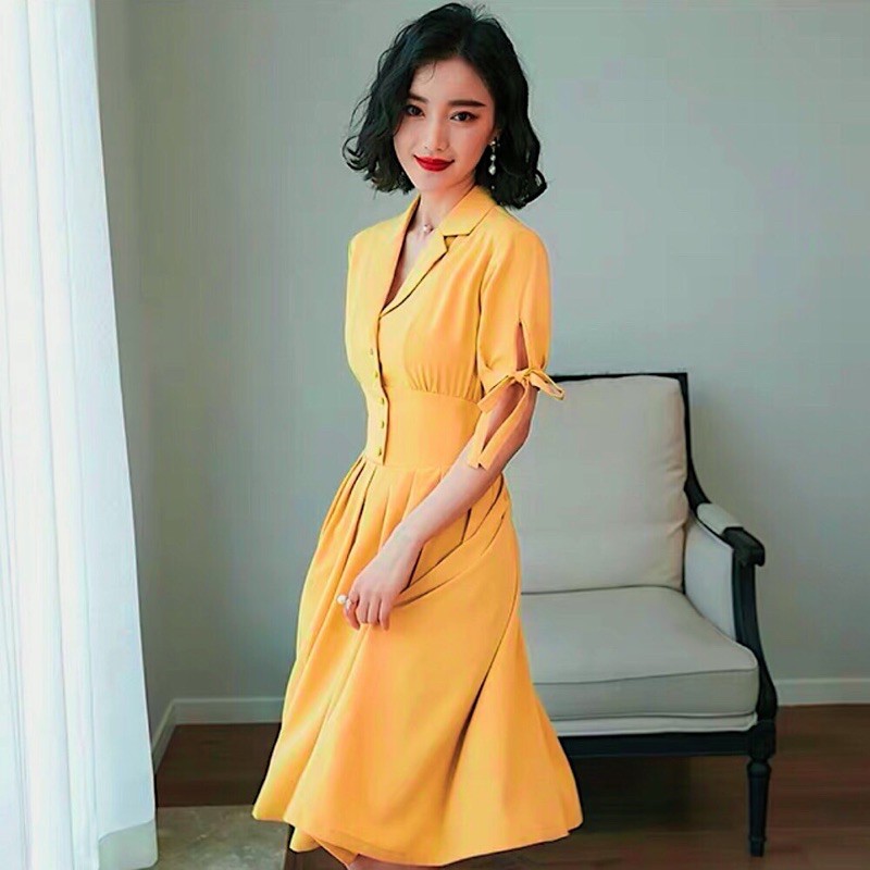 Đầm sm vàng nghệ nút bọc