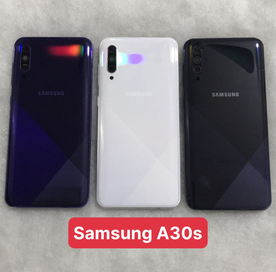 Bộ vỏ sườn  Samsung A30s zin (bộ gồm lưng, sườn, phím bấm, kính camera)