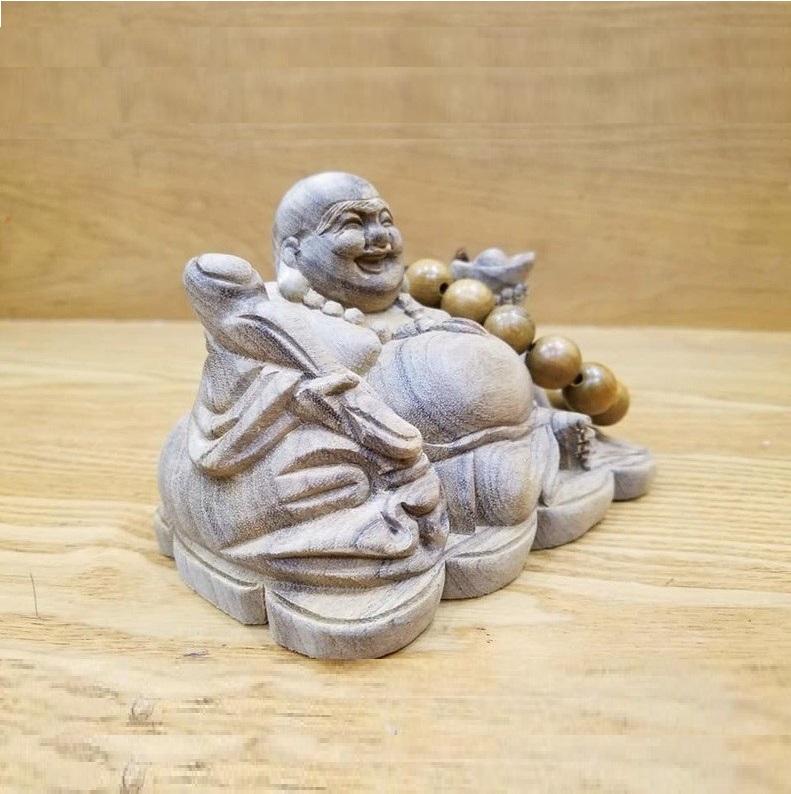 Tượng phật di lặc để ô tô gỗ xá xị