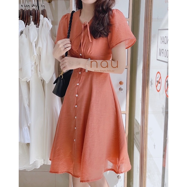 Đầm phối nút ngọc dáng xoè nhẹ cột nơ cổ