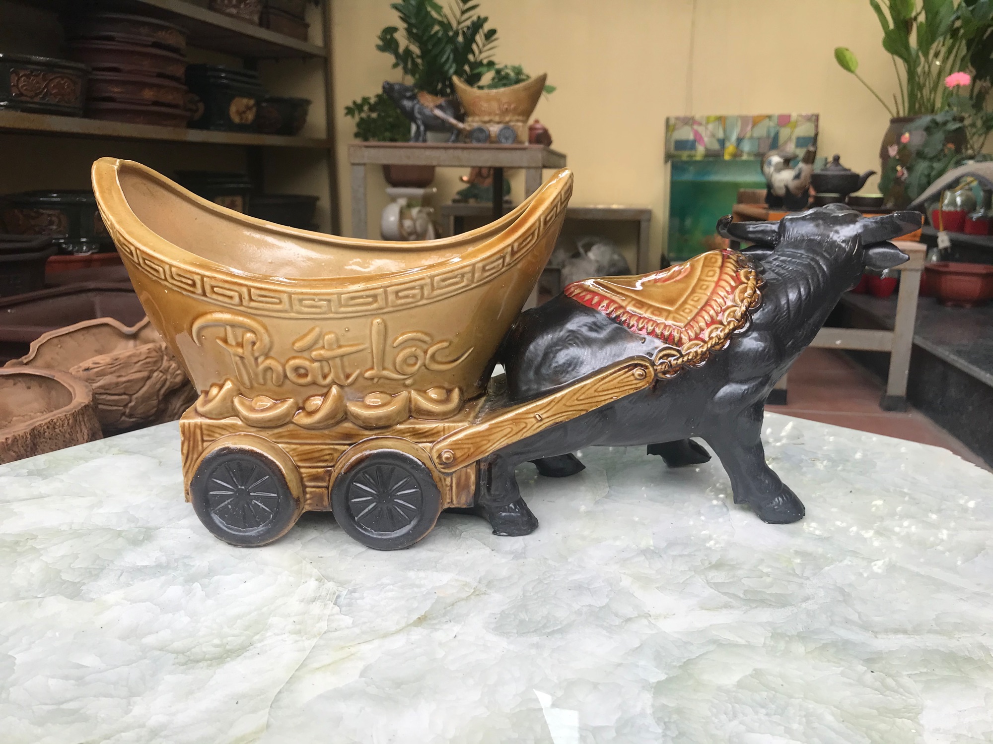 Trâu kéo chậu tài lộc