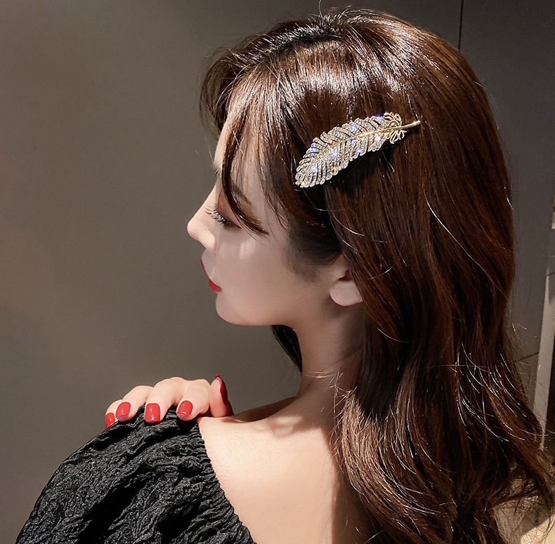 Kẹp tóc họa tiết lông vũ đính đá lấp lánh TOC09