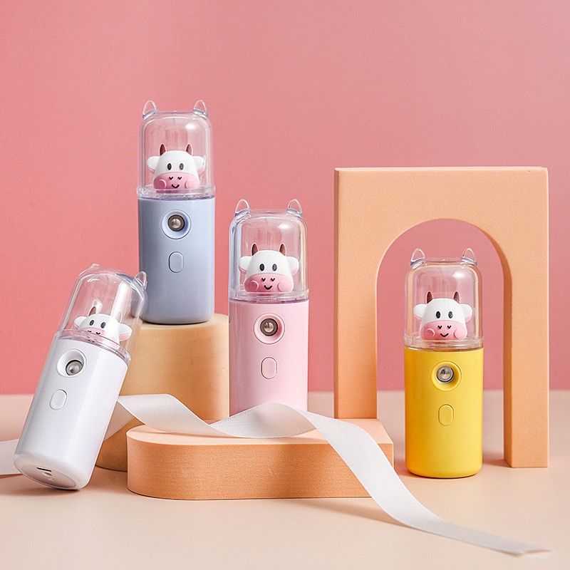 Máy phun sương mini cầm tay hình bò sữa