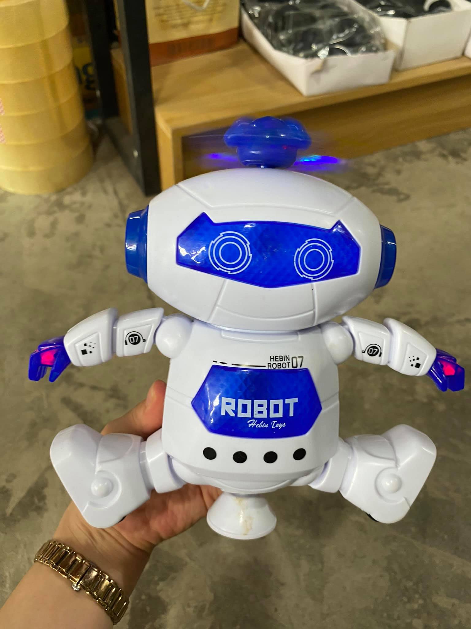 Đồ chơi robot xoay 360 độ có nhạc cho bé