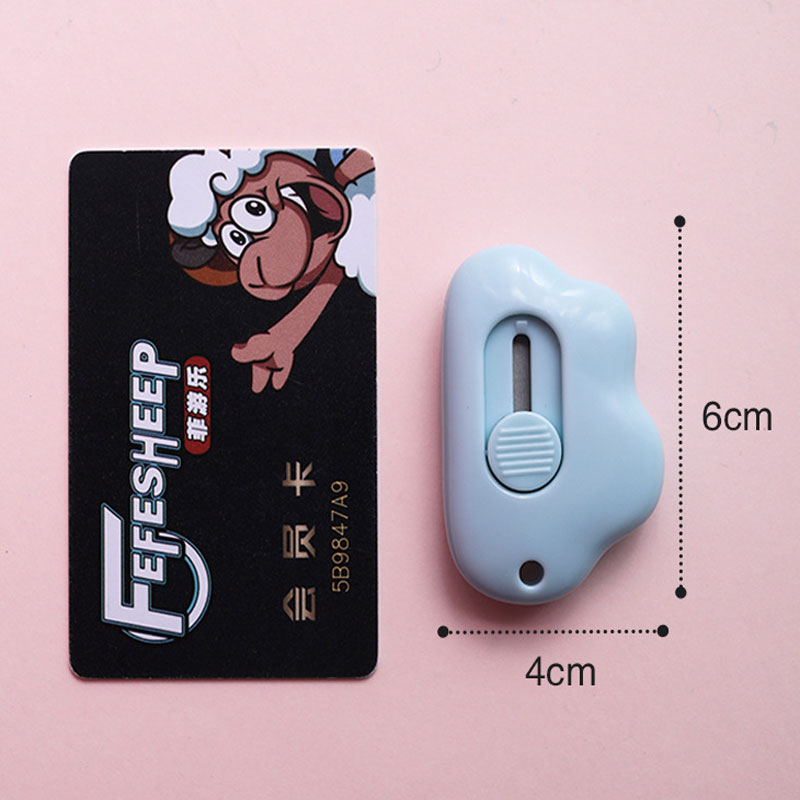 Cute and compact cloud-shaped paper cutter with self-retracting blade, safe and convenient
