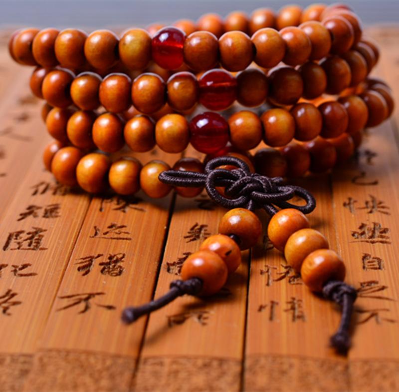 Vòng tay gỗ Tử Đàn 216 hạt (có tua rua bánh xe Pháp Luân)