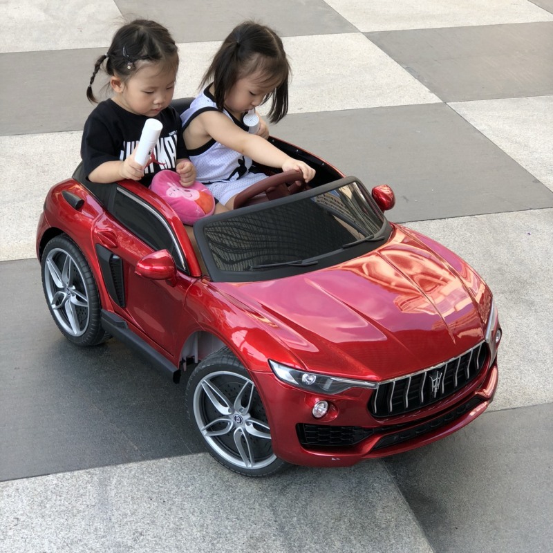 Ô tô xe điện trẻ em KUPAI 2021 cho bé 2 chỗ 4 động cơ tự lái và điều khiển (Đỏ-Trắng-Cam)