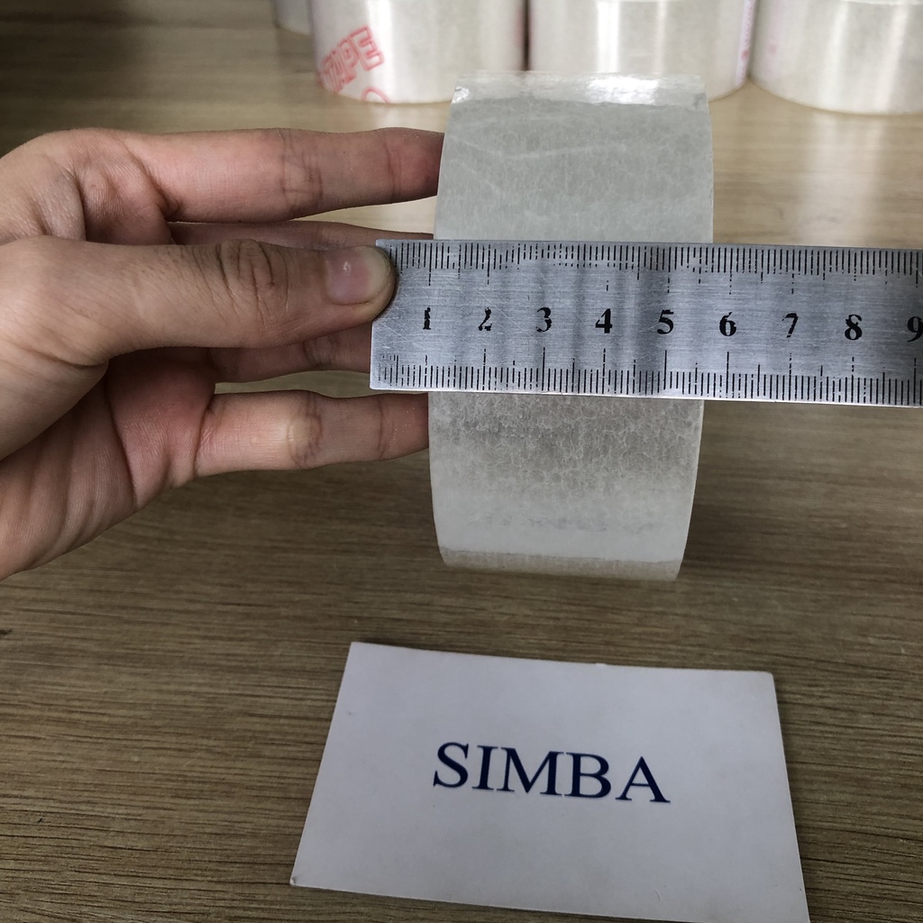 1 cuộn Băng keo  trong  100Yard lõi mỏng 5ly (1 kg /cây )