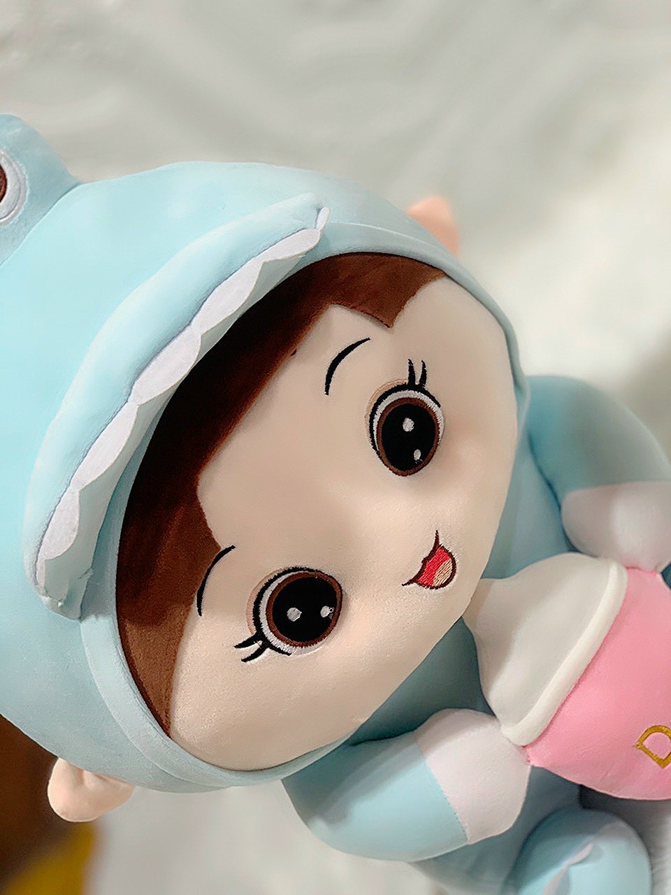 Doll (coslay dinosaur) hugging milk tank