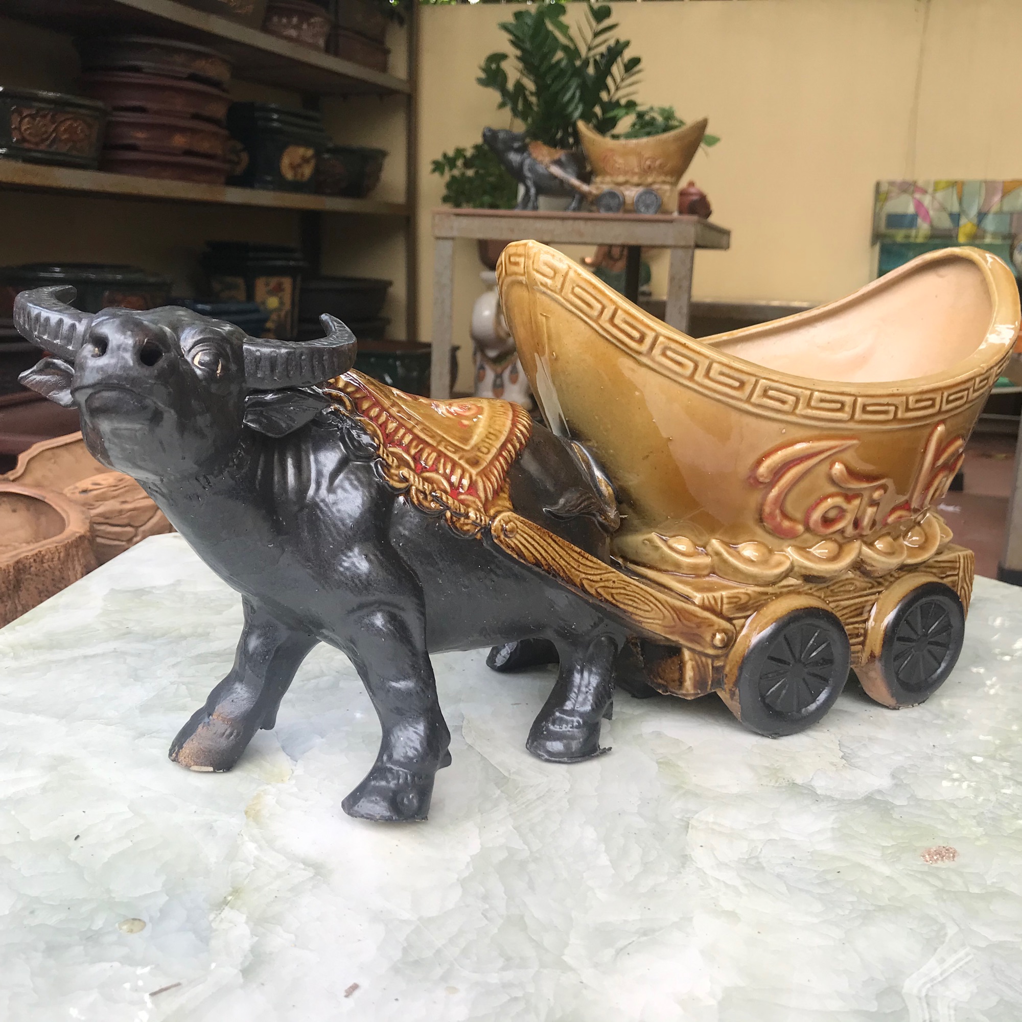 Trâu kéo chậu tài lộc