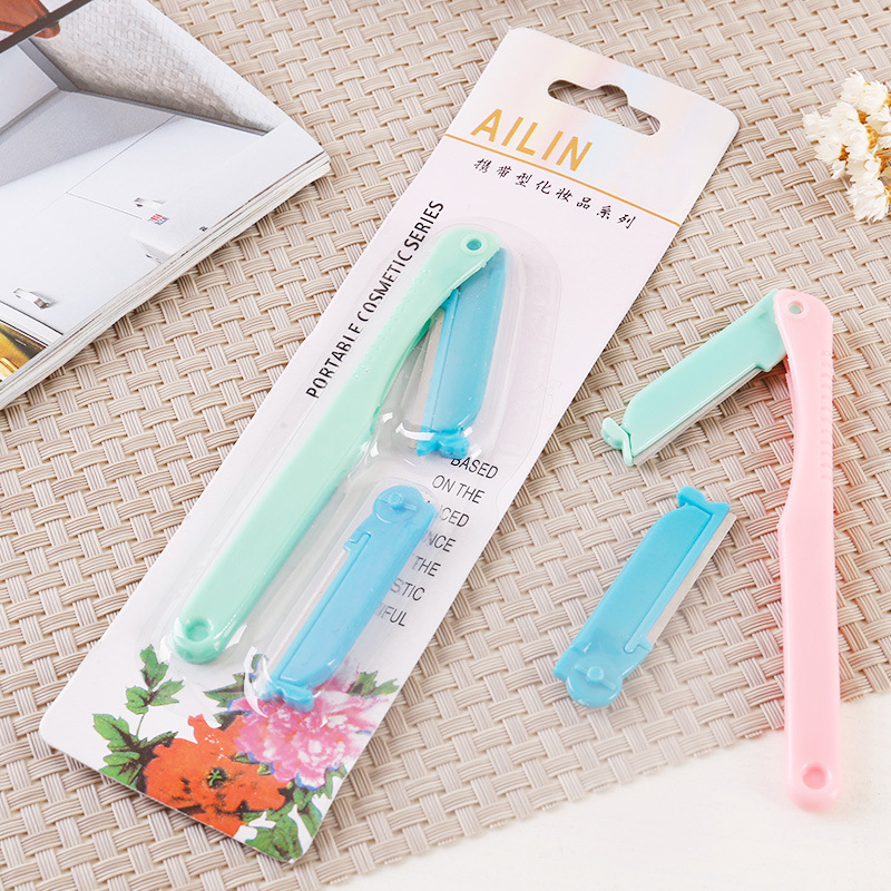 Utility mini eyebrow trimmer with replacement blades