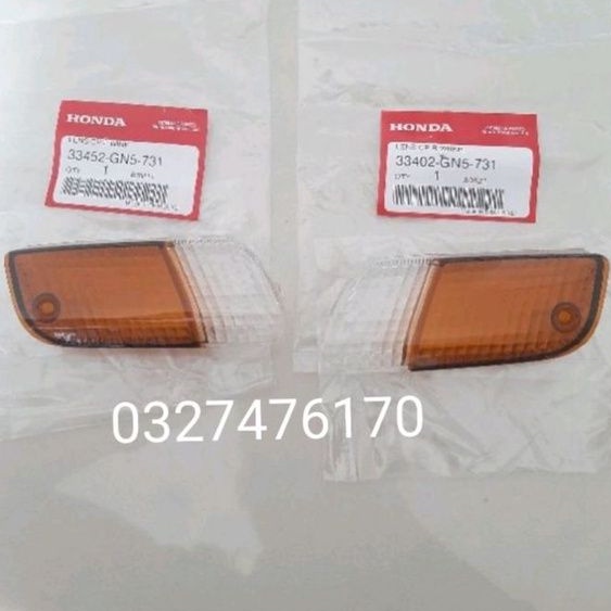Cặp nắp võ đèn xi nhan trước xe DREAM lùn zin honda thái