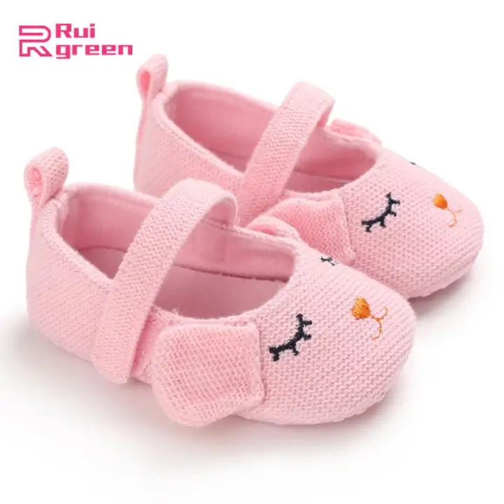 green baby shoes