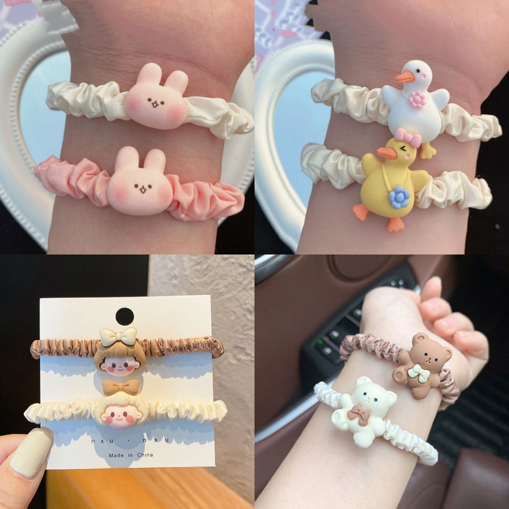 Scrunchies dây cột tóc cô gái nhỏ xinh xắn