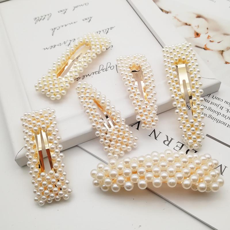 Kẹp tóc mái hình nơ đính ngọc trai