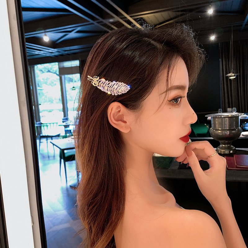 Kẹp tóc họa tiết lông vũ đính đá lấp lánh TOC09