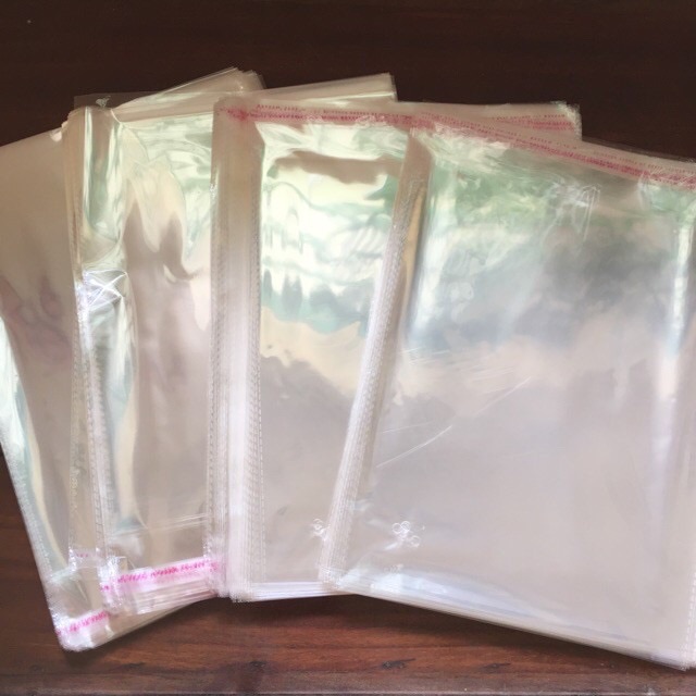 [Giá Siêu Rẻ] 1 kg túi bọc ni lông bóng kiếng có keo dán miệng - bao có nắp đựng quần áo trẻ em người lớn hàng hóa bịch nilon lì xì hay trang sức - túi OPP nilong trong suốt bóng kính dán mép có nhiều kích thước