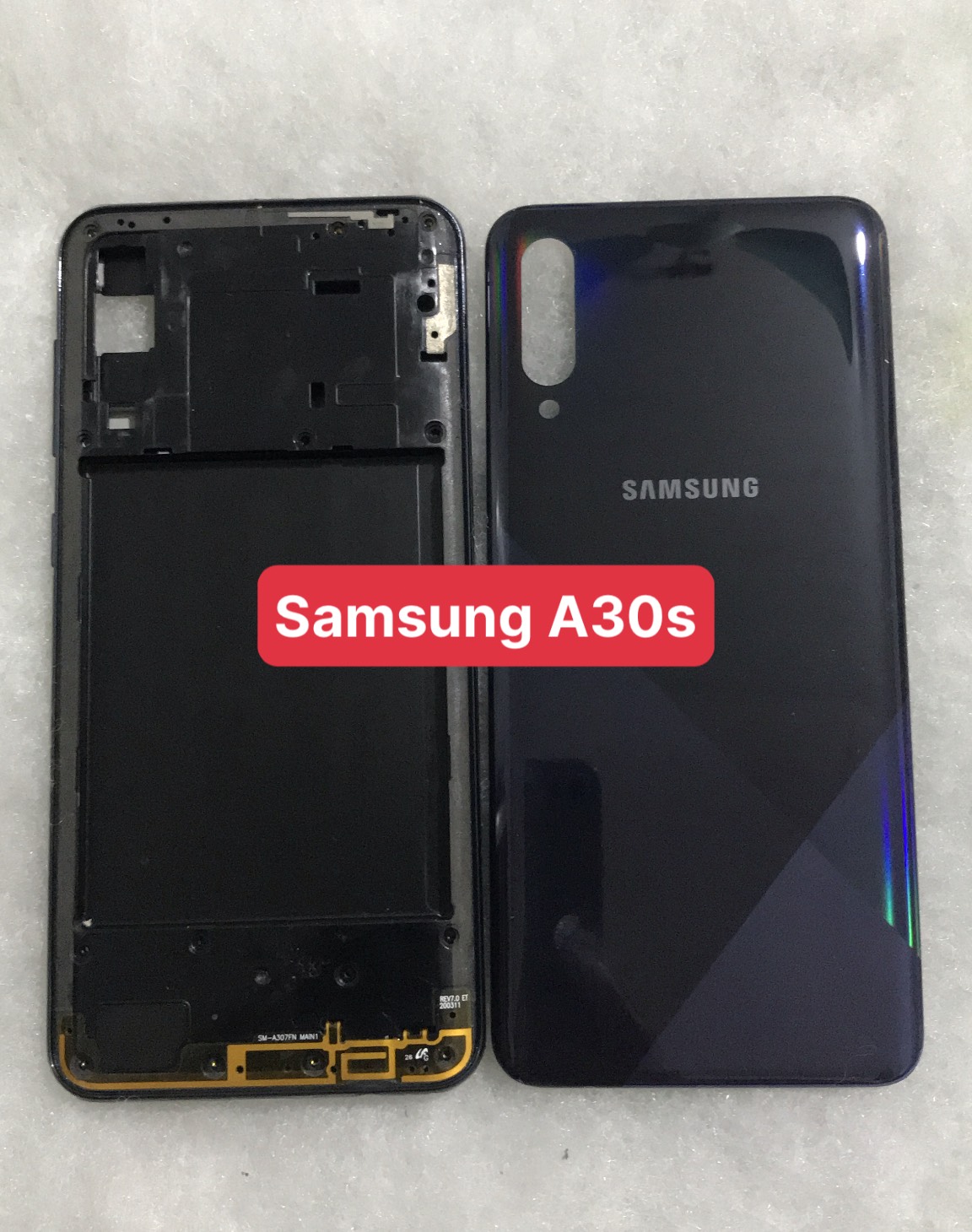 Bộ vỏ sườn  Samsung A30s zin (bộ gồm lưng, sườn, phím bấm, kính camera)