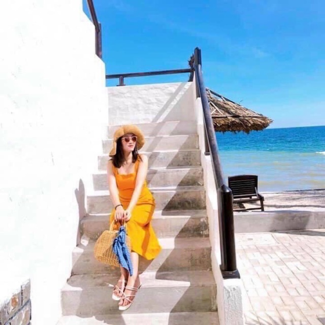 Đầm vàng nghệ nơ sau