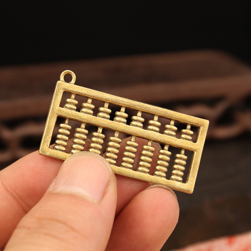 Móc khóa phong thủy hình bàn tính cổ