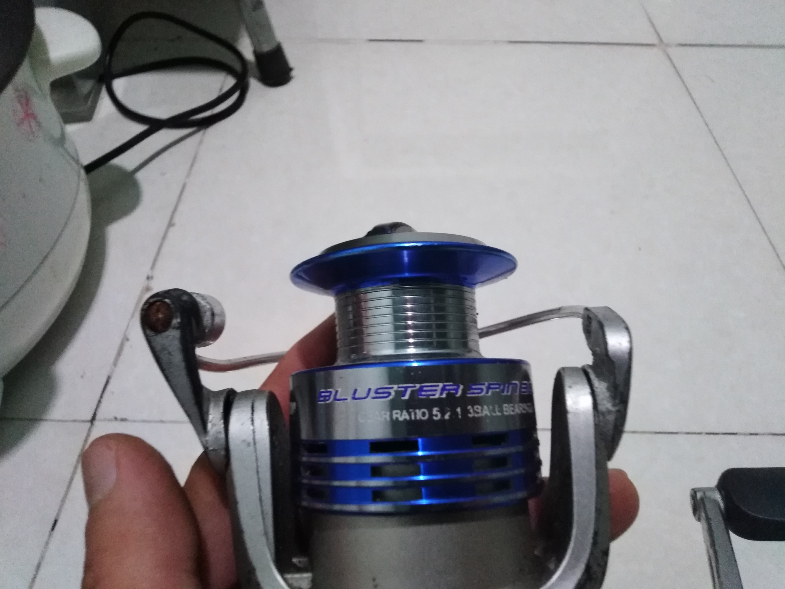 Máy câu bãi nhật Bluster spin 3000 cối kim loại